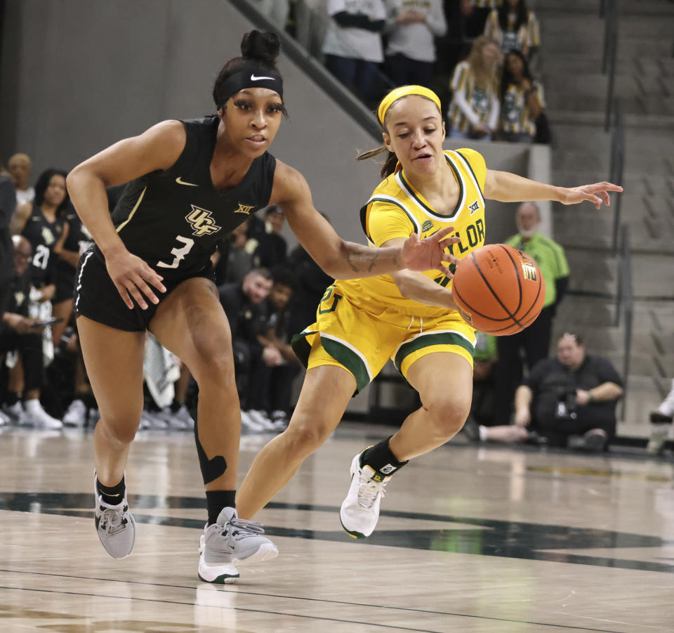 Baylor guard Jada Walker, right, steals the ball away from Central Florida guard Kaitlin Peterson during the first half of an NCAA college basketball game, Saturday, Jan. 20, 2024, in Waco, Texas. (Rod Aydelotte/Waco Tribune-Herald via AP)