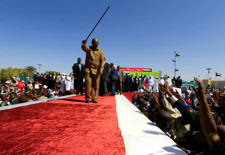 FILE PHOTO: Sudan's President Omar al-Bashir waves to his supporters during a rally at the Green Square in Khartoum, Sudan January 9, 2019. REUTERS/Mohamed Nureldin Abdallah/File Photo