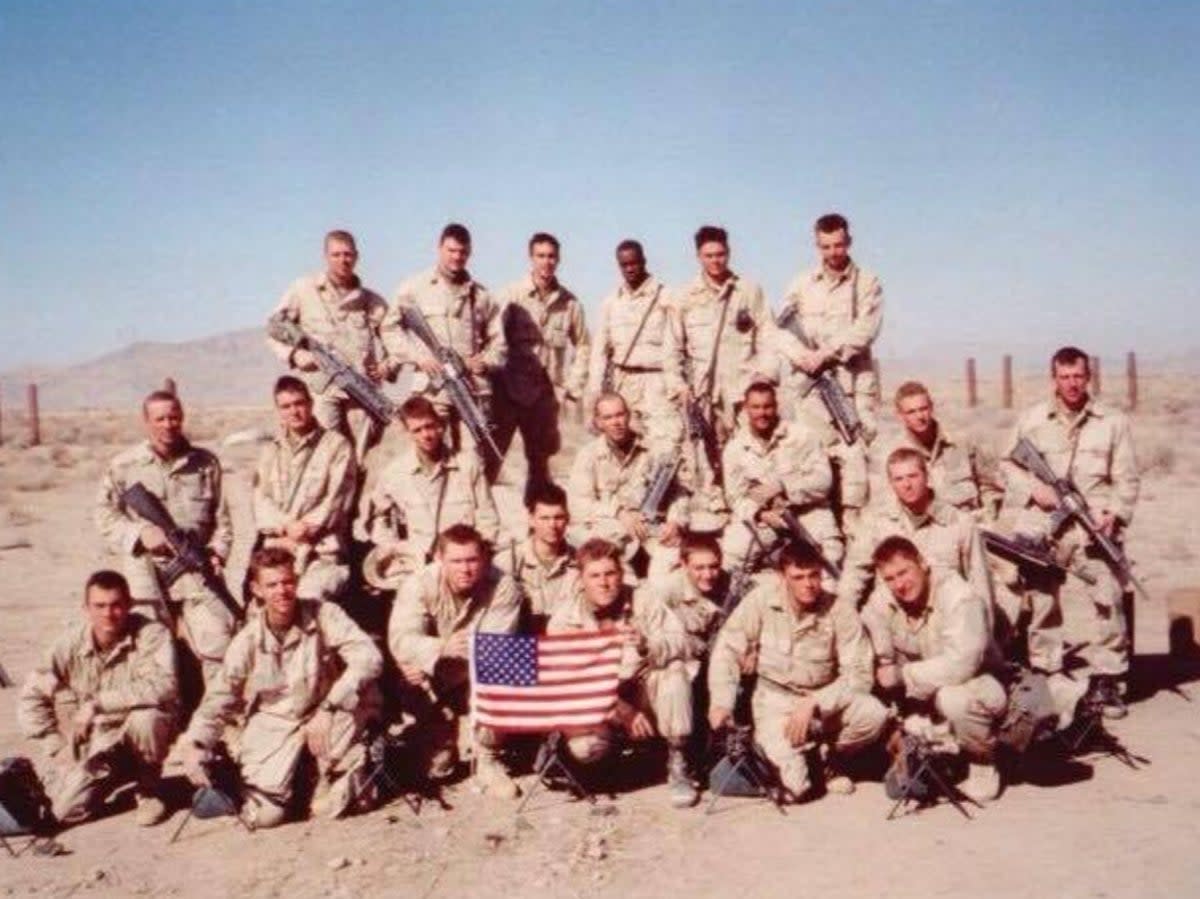 Sgt Bill Bee (front row, fourth from left) is seen with his platoon during the War on Terror (Courtesy of Bill Bee)