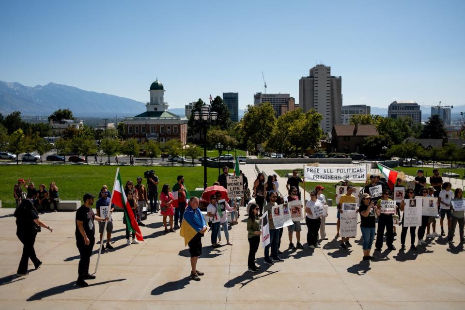 People attend a protest against the Iranian regime at the Capitol in Salt Lake City on Saturday. The protest was held on the one-year anniversary of the death of Mahsa Amini, who was arrested by Iran’s morality police for allegedly violating the country’s strict dress code for women.