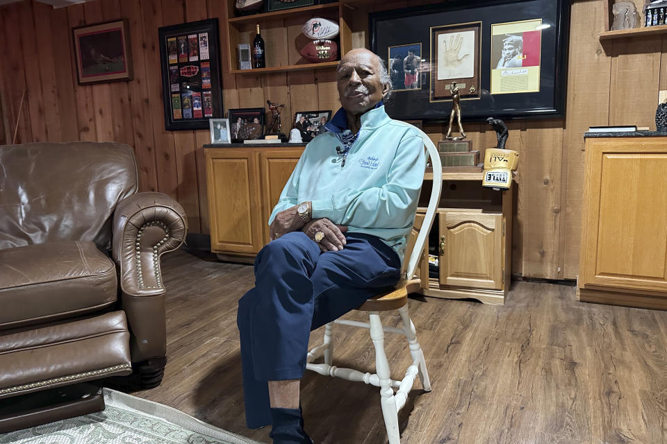 Gregory Eaton sits in a chair during an interview at his home, Tuesday, Jan. 30, 2024 in Lansing, Mich. Eaton is a member of the exclusive "never missed a Super Bowl" club. He and two friends, all in their 80s, plan to be in Las Vegas on Sunday for Super Bowl 58. (AP Photo/Mike Householder)