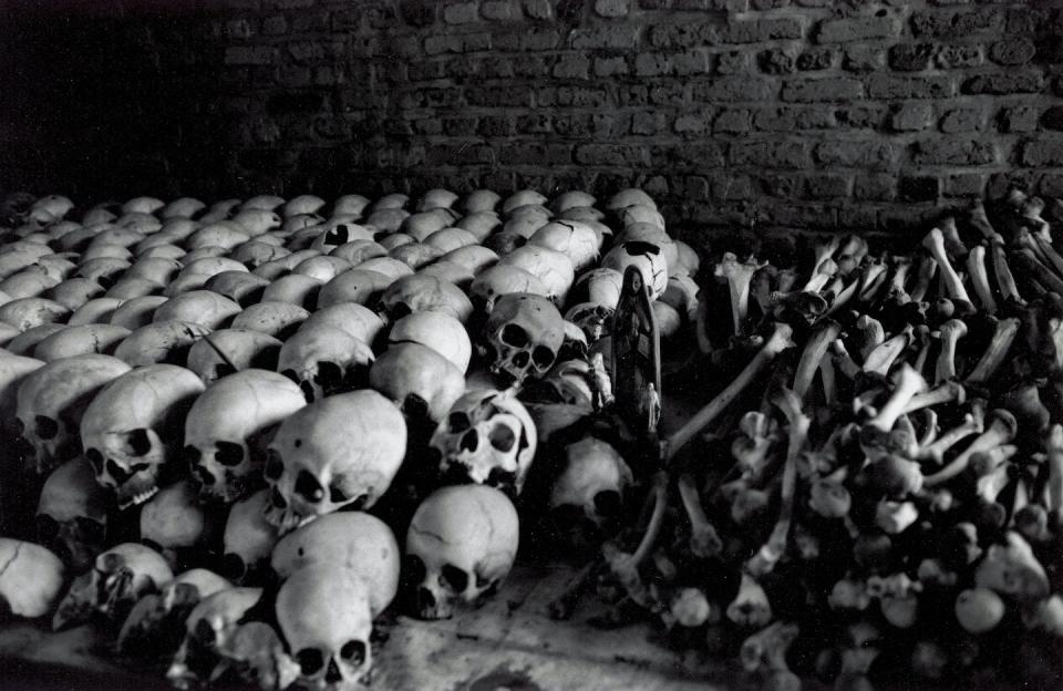 A row of human skulls and remains cover the interior of a church in Kigali following the 1994 genocide in Rwanda. <a href="https://media.gettyimages.com/id/3126839/photo/ntarama-memorial-in-rwanda.jpg?s=1024x1024&w=gi&k=20&c=8aciSOtyfY3kmC5B1lO4lijVZNkSEEKYLIjKNQXTZT8=" rel="nofollow noopener" target="_blank" data-ylk="slk:Lane Montgomery/Getty Images;elm:context_link;itc:0;sec:content-canvas" class="link ">Lane Montgomery/Getty Images</a>