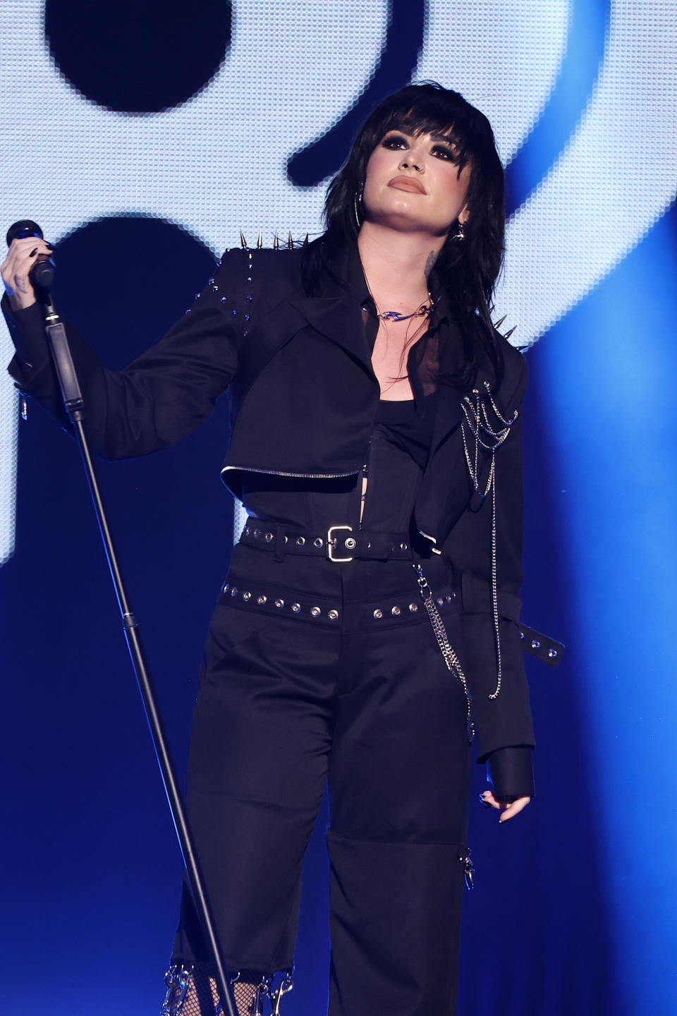 Close-up of Demi performing onstage