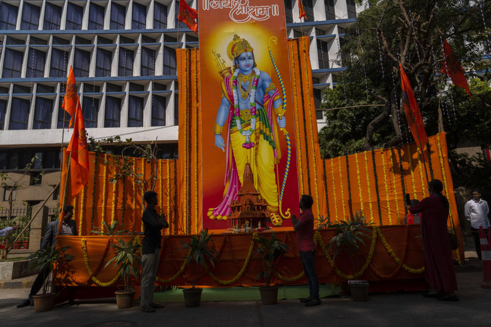 People offer prayers before an image of Hindu Lord Ram in Mumbai, India, during the inauguration of a temple dedicated to the Hindu god in Ayodhya, Monday, Jan. 22, 2024. Indian Prime Minister Narendra Modi on Monday opened a controversial Hindu temple built on the ruins of a historic mosque in the holy city of Ayodhya in a grand event that is expected to galvanize Hindu voters in upcoming elections. (AP Photo/Rafiq Maqbool)