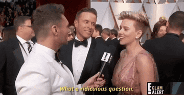 A GIF of Scarlett Johansson being interviewed on the red carpet, she's saying 'What a ridiculous question'