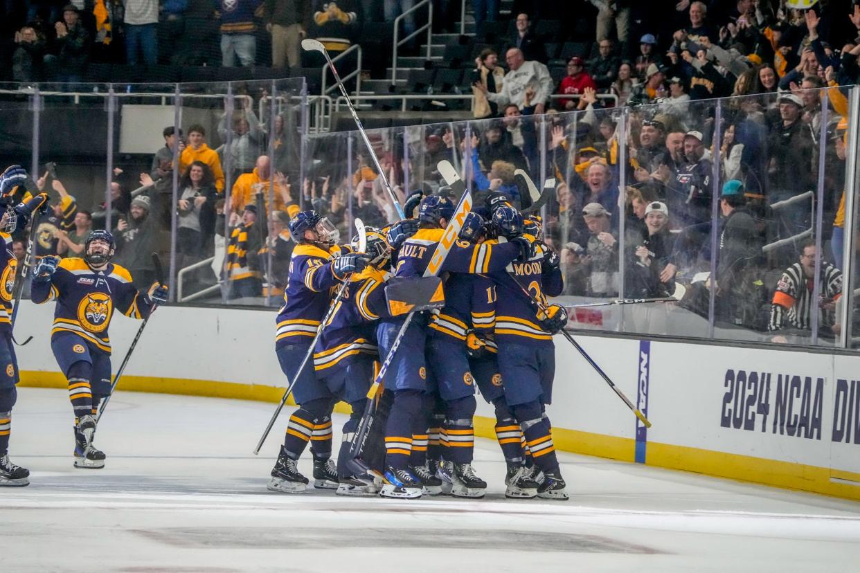 Quinnipiac players celebrate after defeating Wisconsin in OT on Friday.