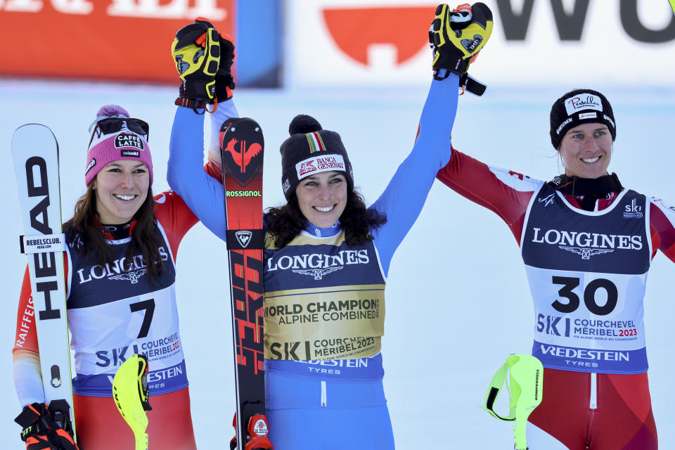 Italy's Federica Brignone, center, winner of an alpine ski, women's World Championship combined race, celebrates with second-placed Switzerland's Wendy Holdener, left, and third-placed Austria's Ricarda Haaser, in Meribel, France, Monday, Feb. 6, 2023. (AP Photo/Marco Trovati)