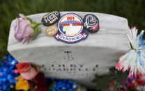 <p>Tokens are left on the gravestone of Army First Lt. Colby J. Umbrell on Memorial Day in Section 60 at Arlington National Cemetery on Monday, May 30, 2016. Umbrell died May 3, 2007, in Musayyib, Iraq, while serving during Operation Iraqi Freedom. (Photo: Carolyn Kaster/AP) </p>