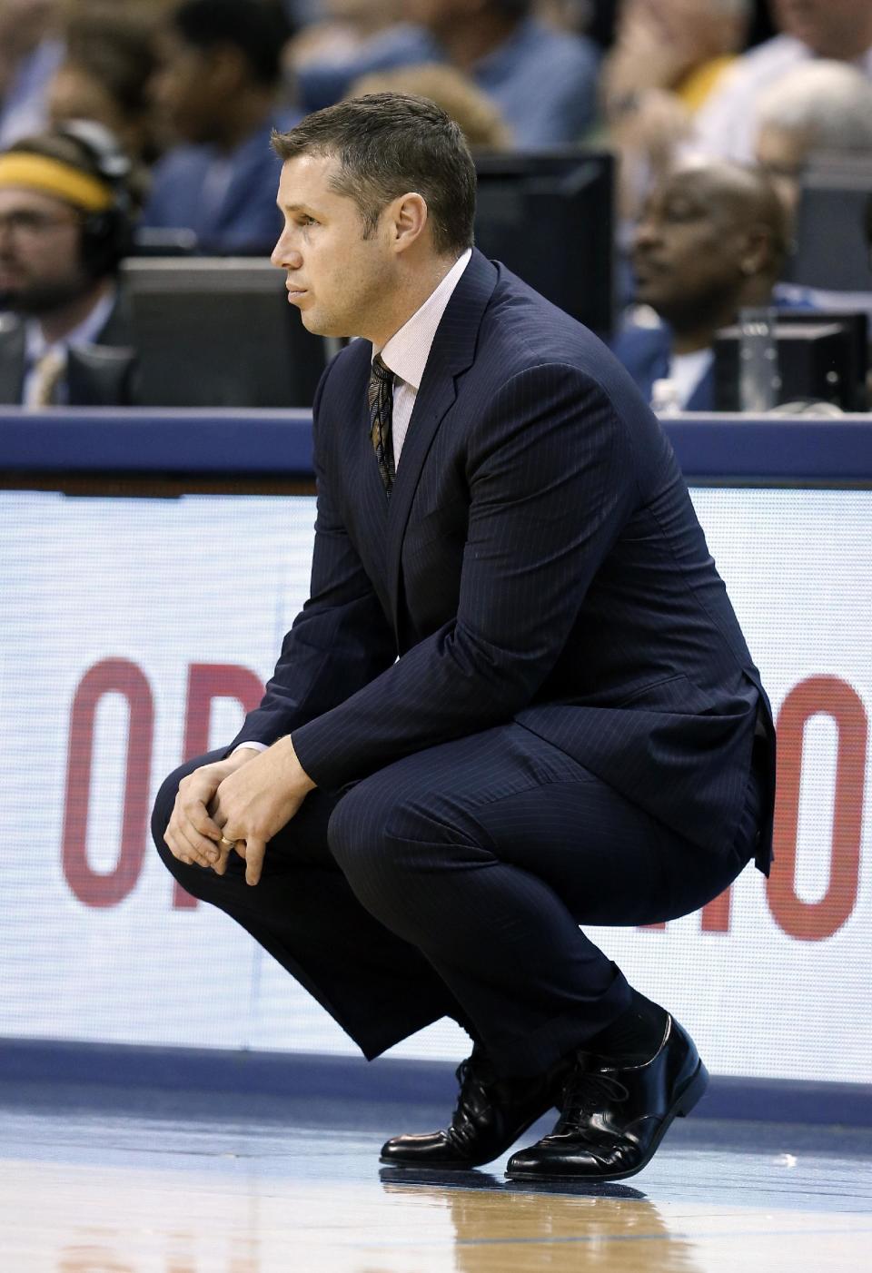 Memphis Grizzlies coach David Joerger watches the action in the first half of Game 3 of an opening-round NBA basketball playoff series against the Oklahoma City Thunder on Thursday, April 24, 2014, in Memphis, Tenn. (AP Photo/Mark Humphrey)