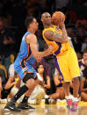 Lakers guard Kobe Bryant, right, posts up Oklahoma City's Thabo Sefolosha on May 19 in Los Angeles. (Photo by Stephen Dunn/Getty Images)