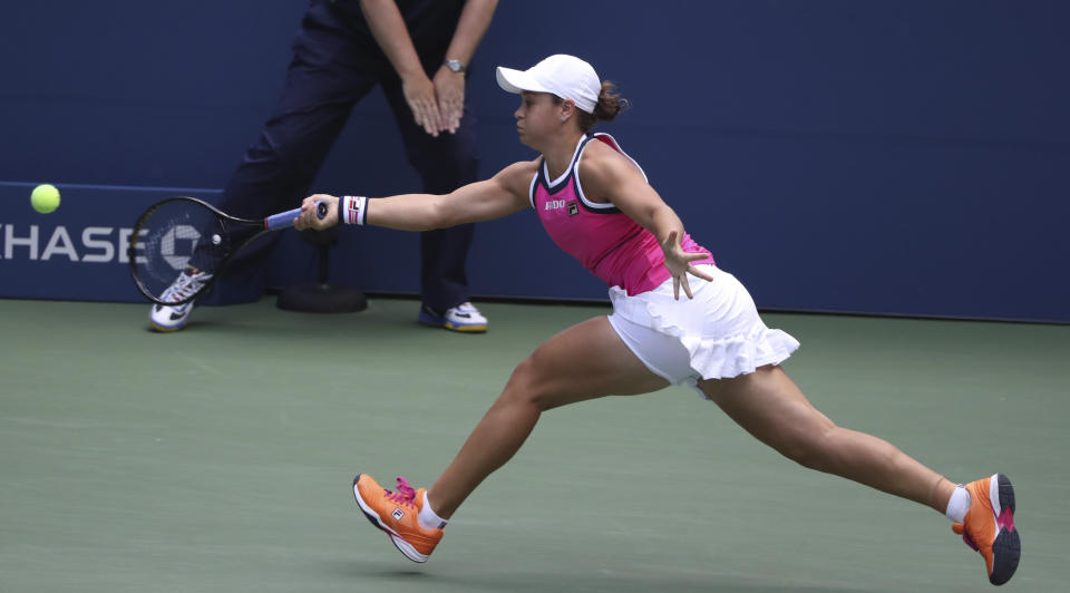 Ashleigh Barty, of Australia, stretches for a return against Qiang Wang, of China, during round four of the US Open tennis championships Sunday, Sept. 1, 2019, in New York. (AP Photo/Kevin Hagen)