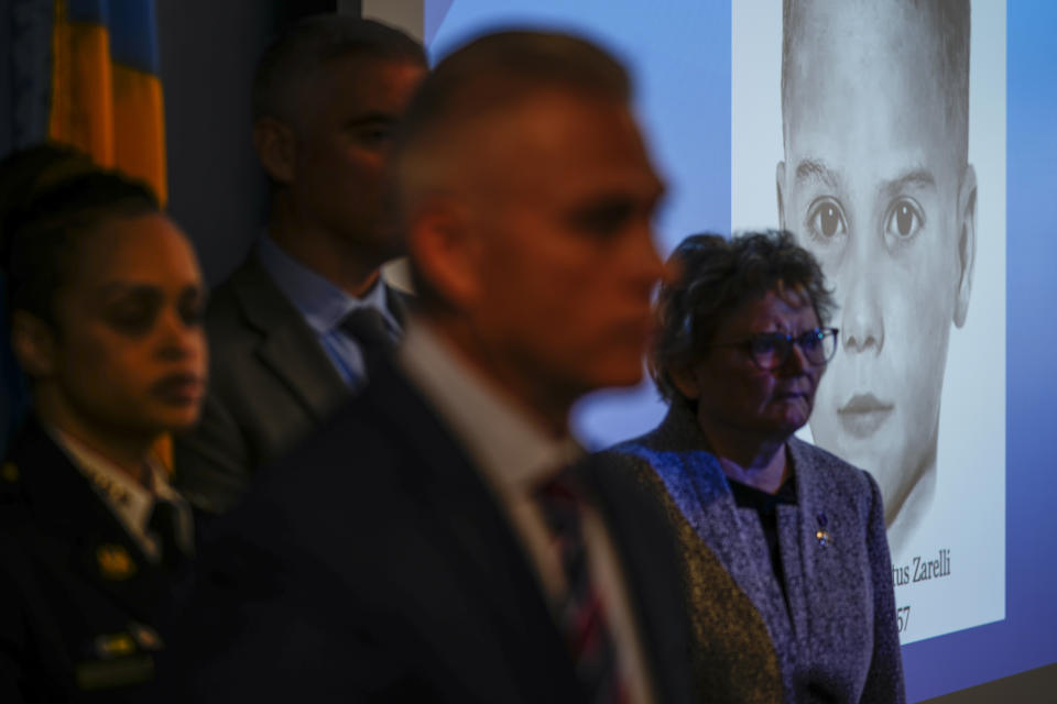 Philadelphia Police Captain Jason Smith, center, speaks with members of the media during a news conference in Philadelphia, Thursday, Dec. 8, 2022. Nearly 66 years after the battered body of a young boy was found stuffed inside a cardboard box, Philadelphia police have revealed the identity of the victim in the city's most notorious cold case. Police identified the boy as Joseph Augustus Zarelli. (AP Photo/Matt Rourke)