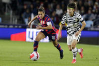 United States forward Carli Lloyd (10) chases Seonjoo Lim (6) in the first half of a soccer friendly match Tuesday, Oct. 26, 2021, in St. Paul, Minn. (AP Photo/Andy Clayton-King)