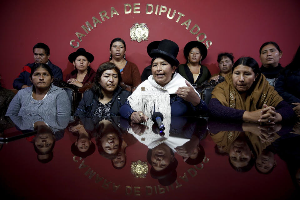 Movement Toward Socialism, MAS, legislators Juana Quispe, front row, from left; Bridge Quiroga, Concepcion Ortiz and Ayda Villarroel, meet with The Associated Press in the Chamber of Deputies, in La Paz, Bolivia, Tuesday, Nov. 19, 2019. MAS lawmakers loyal to former President Evo Morales have majority in congress. Bolivia is wracked by civil unrest following the resignation of Morales, who fled to Mexico, over a disputed election. (AP Photo/Natacha Pisarenko)