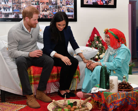 Britain's Prince Harry and Meghan Duchess of Sussex during a Henna ceremony on a visit to boarding house in the town of Asni, Morocco February 24, 2019. Tim Rooke/Pool via REUTERS