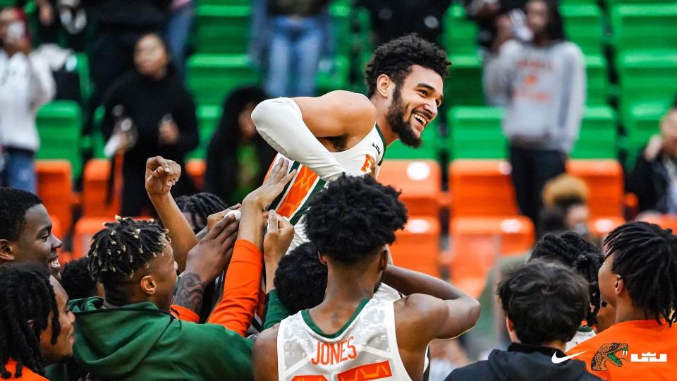 FAMU's Dimingus Stevens celebrates with teammates after his last-second three-pointer lifted the Rattlers to a dramatic victory Monday night at the Al Lawson Center.