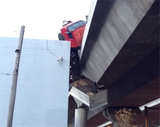 Truck dangling from the Bolte Bridge. Photo: Michael Scanlan, @MScanlan7