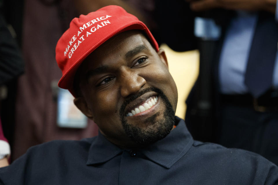 <p> Rapper Kanye West smiles as he listens to a question from a reporter during a meeting in the Oval Office of the White House with President Donald Trump, Thursday, Oct. 11, 2018, in Washington. (AP Photo/Evan Vucci) </p>