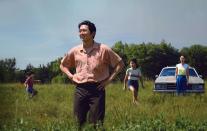 <p>The critically acclaimed<em> Minari</em> followed the Korean American Yi family, who try to live out the American dream through farming in rural Arkansas in the 1980s. The drama was based on director Lee Isaac Chung's real-life upbringing and debuted with high remarks at Sundance in 2020, winning both the Audience Award and the Grand Jury Prize.</p> <p>It was <a href="https://people.com/movies/oscars-2021-complete-list-of-nominees/" rel="nofollow noopener" target="_blank" data-ylk="slk:up for six Oscars;elm:context_link;itc:0;sec:content-canvas" class="link ">up for six Oscars </a>in 2021, including Best Picture, Best Supporting Actress (for Youn Yuh-jung), Best Director, Best Original Score, Best Original Screenplay and Best Actor for Yeun. <a href="https://people.com/movies/oscars-2021-steven-yeun-chloe-zhao-make-history/" rel="nofollow noopener" target="_blank" data-ylk="slk:Yeun wasthe first Asian American actor;elm:context_link;itc:0;sec:content-canvas" class="link ">Yeun wasthe first Asian American actor</a> nominated for Best Actor while Yuh-jung, who won a Screen Actors Guild Award for her work, was the first South Korean actress to be nominated for and win Best Supporting Actress.</p> <p>The film took home best motion picture in a foreign language at the Golden Globes. Although the <a href="https://people.com/movies/stars-slam-golden-globes-as-american-set-drama-minari-competes-in-foreign-language-category/" rel="nofollow noopener" target="_blank" data-ylk="slk:Globes received backlash for placing the film in the foreign language category;elm:context_link;itc:0;sec:content-canvas" class="link ">Globes received backlash for placing the film in the foreign language category</a> even though it was an American film, with an American lead and director, Yeun simply directed his attention to the release of the film, <a href="https://www.instagram.com/p/CKAftd5ph45/" rel="nofollow noopener" target="_blank" data-ylk="slk:posting the movie poster on Instagram;elm:context_link;itc:0;sec:content-canvas" class="link ">posting the movie poster on Instagram</a> and writing the caption, "this one is for everybody."</p> <p>Yeun opened up about the intention behind the story in an interview with the <a href="https://www.washingtonpost.com/arts-entertainment/2021/02/12/steven-yeun-minari-interview/" rel="nofollow noopener" target="_blank" data-ylk="slk:Washington Post;elm:context_link;itc:0;sec:content-canvas" class="link "><em>Washington Post</em> </a>this month, saying, "We weren't seeking to define this family's existence through their oppression by the majority, but rather the confidence to speak from their own point of view, intrinsically."</p> <p>"Their existence is valid, and they can just be," he continued. "In some ways, what that is, is just an exercise in humanity."</p>