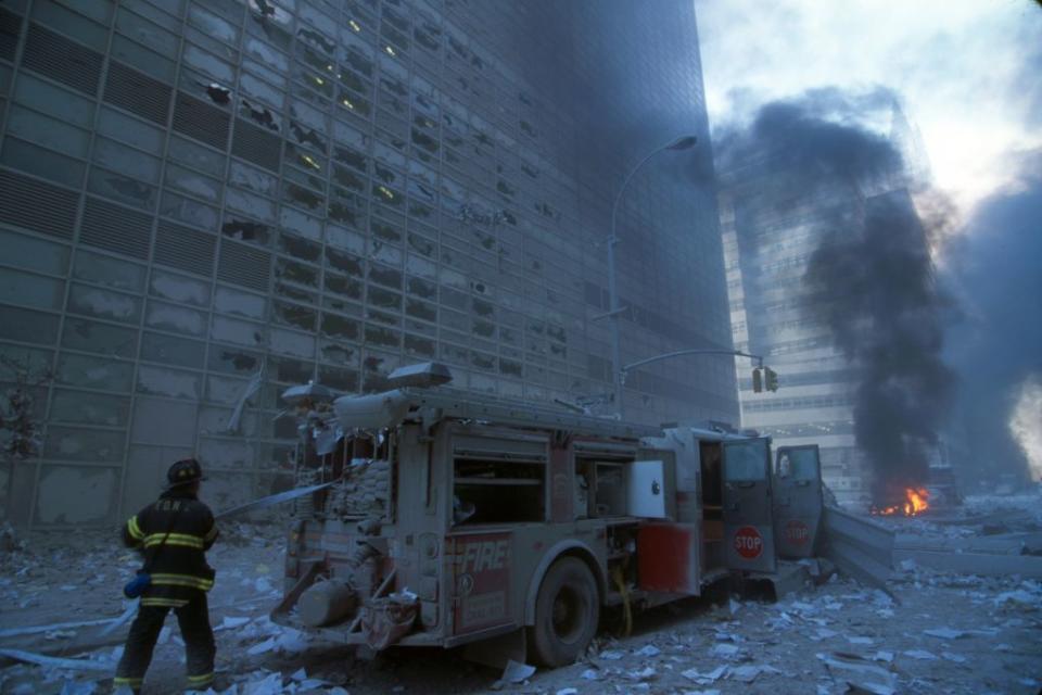 A fire-fighter and engine in the aftermath of 9/11 (Getty Images)