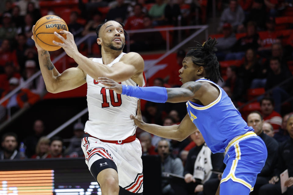 Utah guard Marco Anthony (10) drives against UCLA guard Dylan Andrews during the second half of an NCAA college basketball game Thursday, Feb. 23, 2023, in Salt Lake City. (AP Photo/Jeff Swinger)