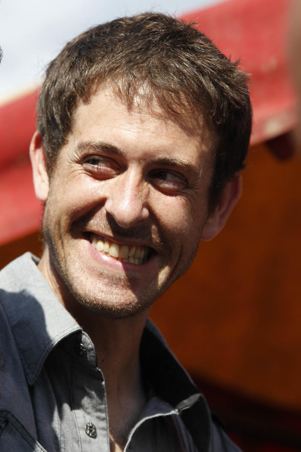 French Journalist Romeo Langlois smiles after being released in San Isidro, southern Colombia, Wednesday, May 30, 2012. French journalist Romeo Langlois , who was taken by rebels on April 28 when they attacked troops he was accompanying on a cocaine-lab eradication mission, was handed over by the rebels to a delegation that included a French diplomat in San Isidro. (AP Photo/Fernando Vergara)