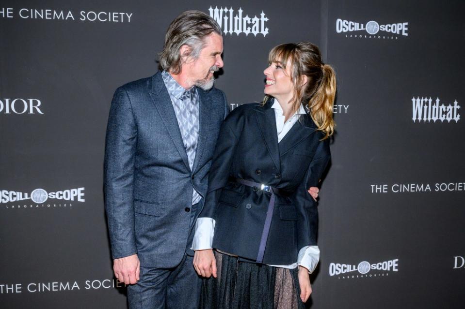 The father-daughter duo share a sweet moment on the carpet. Getty Images