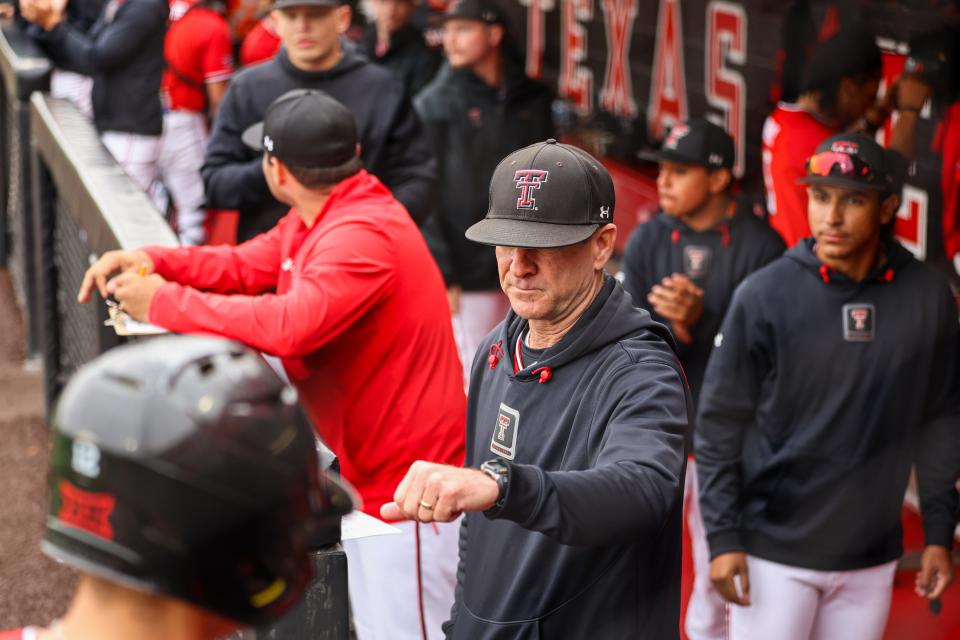 Texas Tech baseball head coach Tim Tadlock gives a Red Raider a fist bump after scoring a run against Oklahoma in game two of their Big 12 conference baseball series, Saturday, May 4, 2024, at Rip Griffin Park.