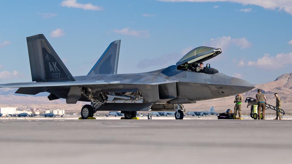 An F-22 from the 525th Expeditionary Fighter Squadron is prepared to forward deploy from Nellis AFB for Exercise Bamboo Eagle. <em>USAF/TSgt Curt Beach</em>