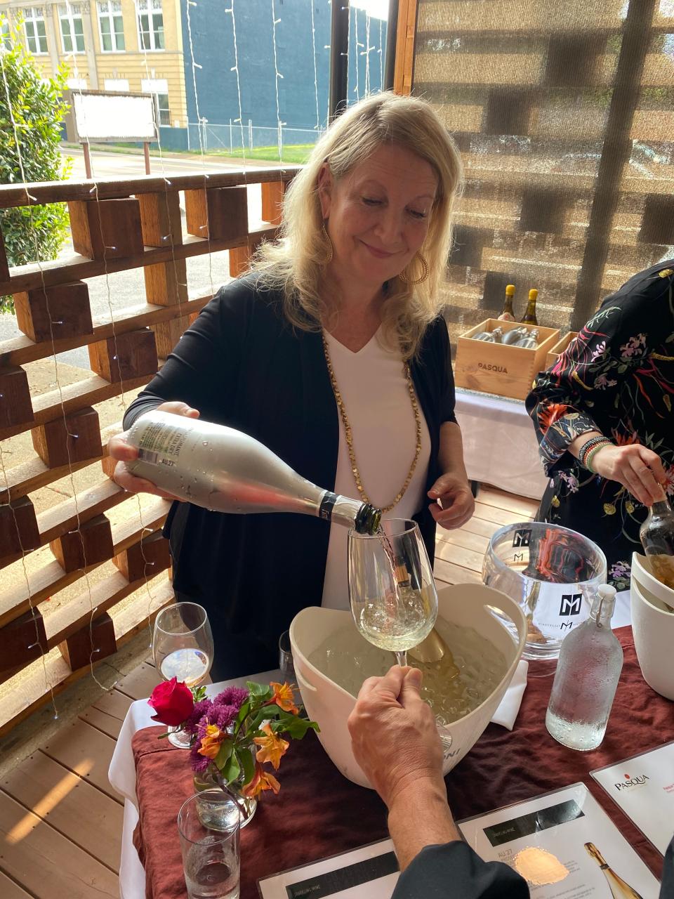 Tiffany Werne, Southeast Regional Manager for
Pasqua USA, pours a glass of wine at a wine event at Bari Ristorante e Enoteca.