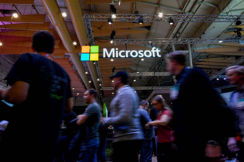 Attendees walk past the logo of US multinational technology company Microsoft during the Web Summit in Lisbon on November 6, 2019: PATRICIA DE MELO MOREIRA/AFP /AFP via Getty Images