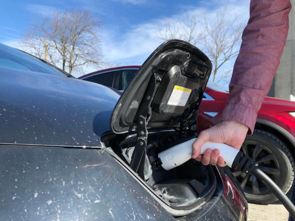 A file photo shows an electric vehicle being charged. The federal government says it is providing $2.5 million in funding for 400 new chargers in public places in Manitoba and Saskatchewan. (Gavin Simms/CBC - image credit)
