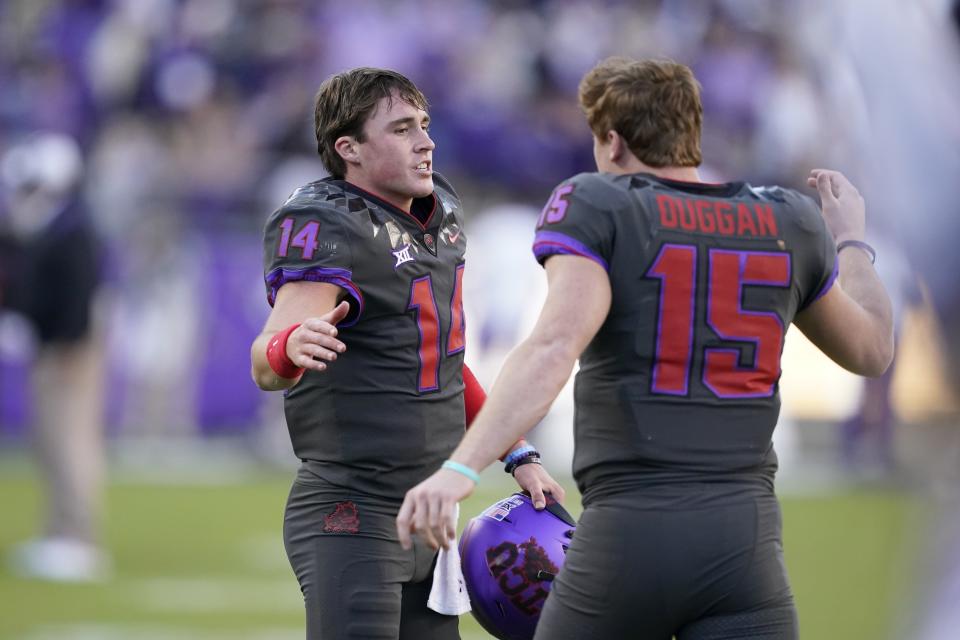 FILE - TCU quarterback Chandler Morris (14) quarterback Max Duggan (15) celebrate during an NCAA college football game against Baylor in Fort Worth, Texas, Saturday, Nov. 6, 2021. TCU is set to kick off its season on Sept. 2, 2022, against Colorado. (AP Photo/Tony Gutierrez, File)