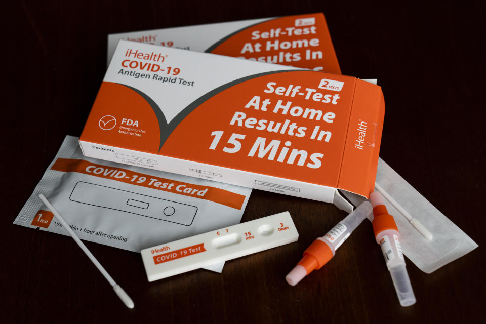 COVID-19 antigen rapid test kits are pictured. / Credit: Tom Williams / Getty Images