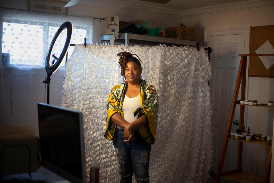 Donica Johns poses for a portrait in her home office in New Orleans, Louisiana, U.S., on June 13, 2020. Johns hasn’t benefited much from the aid offered to small business owners during the crisis, and she isn't alone. Many other black owned businesses that didn’t have existing banking relationships before the crisis hit are having similar experiences.  At the beginning of the year she was in the process of rebranding her skincare business and shopping for an official workspace that would allow her to expand her company. She was forced to put the expansion plans on hold when the coronavirus pandemic hit, and has been struggling to replenish her inventory because of shipping delays caused by the virus. Johns applied for a loan from the Paycheck Protection Program but hasn’t heard back. REUTERS/Kathleen Flynn