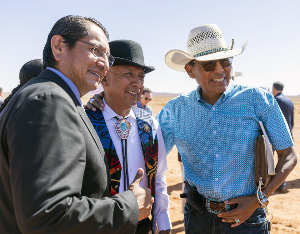 Jonathan Nez, left, president of the Navajo Nation poses for a photo with Rick Nez, and Mark Maryboy, after signing the agreement for the Navajo federal reserved water rights settlement Friday, May 27, 2022 in Monument Vally, Utah.(Rick Egan/The Salt Lake Tribune via AP)