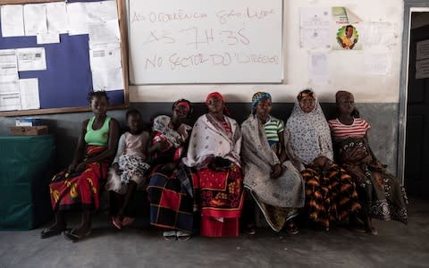 Women wait to be checked at the Maternidade de Murrupelane maternity health centre on July 05 2018 in Nacala, Mozambique - Credit: Xaume Olleros 