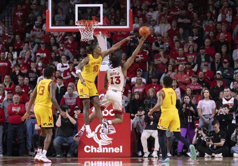 Nebraska's Derrick Walker (13) shoots against Maryland's Julian Reese (10) during overtime of an NCAA college basketball game Sunday, Feb. 19, 2023, in Lincoln, Neb. Nebraska won 70-66. (AP Photo/Rebecca S. Gratz)