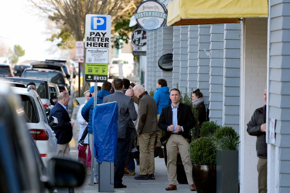 President Joe Biden, center, greets people outside the Henlopen City Oyster House while having lunch at the restaurant in Rehoboth Beach, Del., Saturday, Feb. 17, 2024.