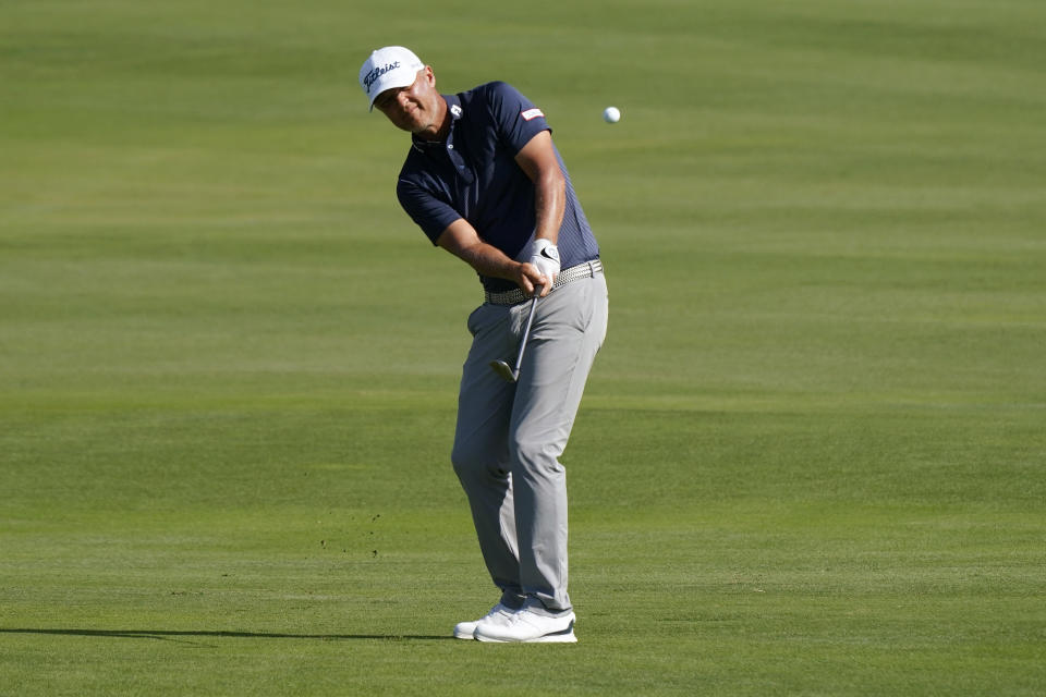 Matt Jones chips onto the 18th green during the final round of the Tournament of Champions golf event, Sunday, Jan. 9, 2022, at Kapalua Plantation Course in Kapalua, Hawaii. (AP Photo/Matt York)