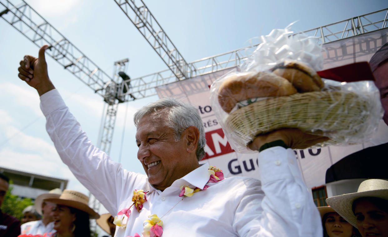 Mexico's presidential candidate for the MORENA party, Andres Manuel Lopez Obrador, holds a bread basket with typical regional breads, during a meeting at San Marcos community, in Guerrero State, Mexico on May 17, 2018. (Photo by FRANCISCO ROBLES / AFP) / The erroneous mention appearing in the metadata of this photo by FRANCISCO ROBLES has been modified in AFP systems in the following manner: Mexico instead of El Salvador. Please immediately remove the erroneous mention from all your online services and delete them from your servers. If you have been authorized by AFP to distribute them to third parties, please ensure that the same actions are carried out by them. Failure to promptly comply with these instructions will entail liability on your part for any continued or post notification usage. Therefore we thank you very much for all your attention and prompt action. We are sorry for the inconvenience this notification may cause and remain at your disposal for any further information you may require.        (Photo credit should read FRANCISCO ROBLES/AFP/Getty Images)