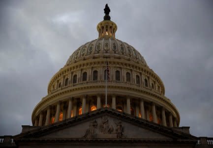 FILE PHOTO: The U.S. Capitol building is lit at dusk ahead of planned votes on tax reform in Washington, U.S., December 18, 2017.   REUTERS/Joshua Roberts/File Photo