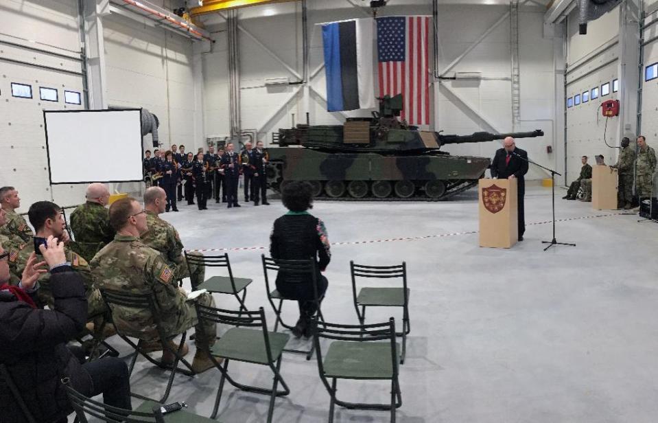 U.S. Ambassador to Estonia James D. Melville Jr. addresses dignitaries in front of an U.S. Army tank, at a hand-over ceremony of the upgraded NATO military base in Tapa, Estonia, Thursday, Dec. 15, 2016. The U.S. military has completed infrastructure investments worth $11.2 million to upgrade the Estonian army base as a part of a U.S. commitment to the alliance's eastern flank, which is facing increasing tensions with Russia. (AP Photo/Vitnija Saldava)