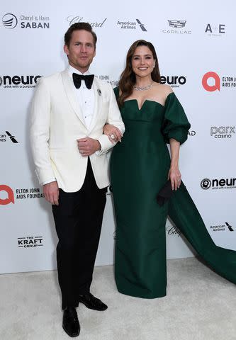 <p>JC Olivera/WireImage</p> Grant Hughes and Sophia Bush attend the Elton John AIDS Foundation's 31st Annual Academy Awards Viewing Party on March 12, 2023 in West Hollywood, California.