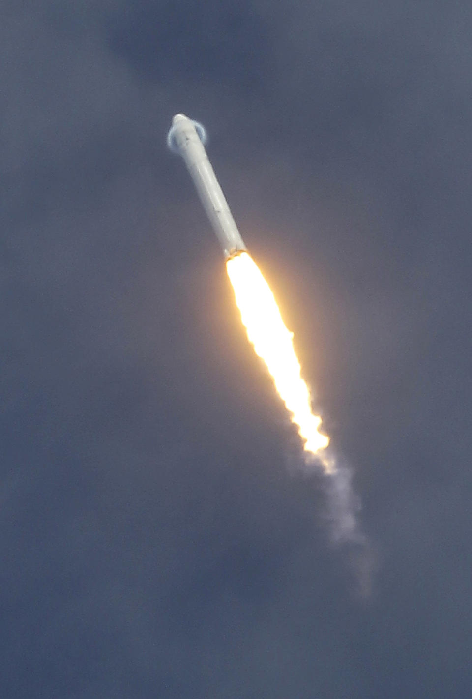 FILE - In this June 4, 2010 file photo, a halo forms around the top of the SpaceX Falcon 9 test rocket as launches from complex 40 at the Cape Canaveral Air Force Station in Cape Canaveral, Fla. A launch scheduled for Saturday, May 19, 2012, will mark for the first time, a private company will send its own rocket to the orbiting International Space Station, delivering food and ushering in a new era in America's space program. (AP Photo/John Raoux, File)