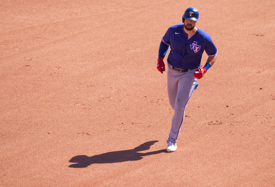 GLENDALE, AZ - MARCH 02: Joey Gallo #13 of the Texas Rangers rounds the bases after hitting a home run against the Chicago White Sox during a spring training game at Camelback Ranch on March 2, 2021 in Glendale, Arizona. (Photo by Rob Tringali/Getty Images)