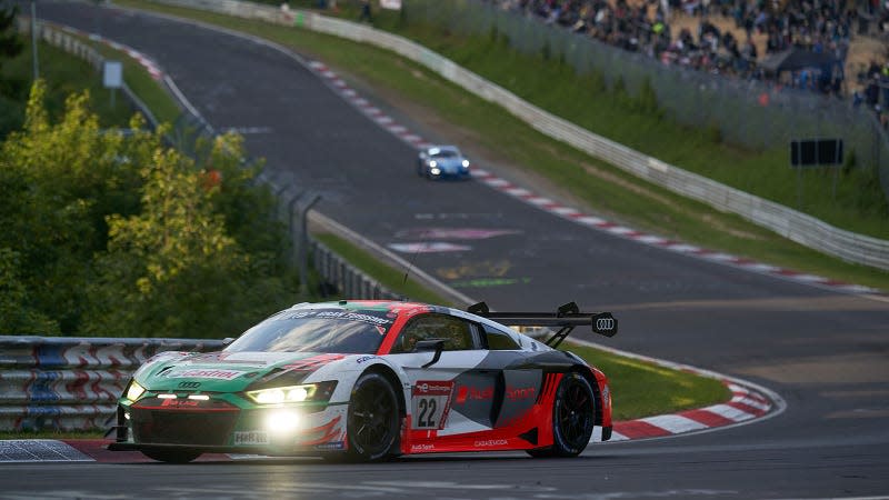 A photo of two cars on track at the Nürburgring. 