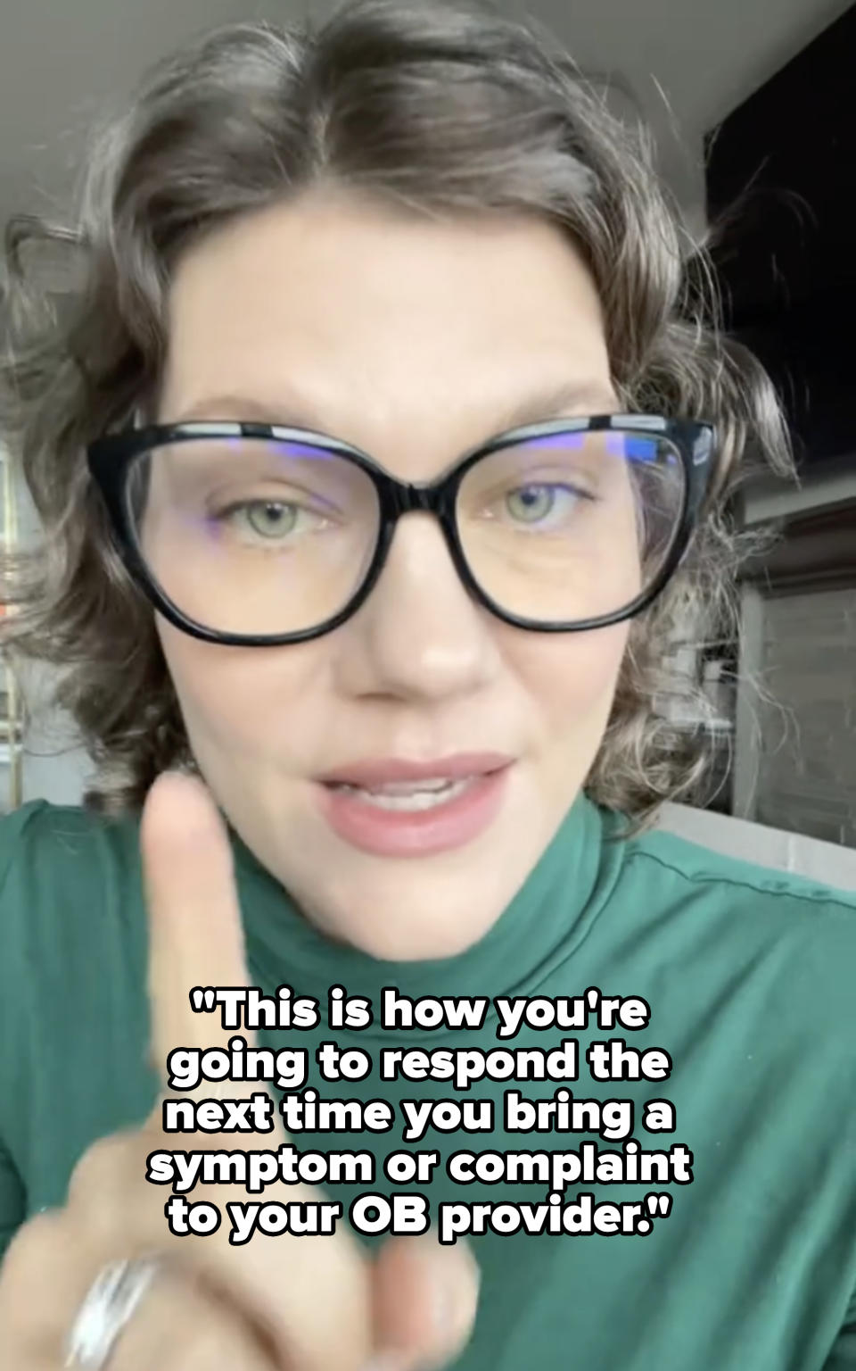 Woman with glasses raising a finger, wearing a turtleneck top with a ring on the finger, with caption about how to respond to "your OB provider"