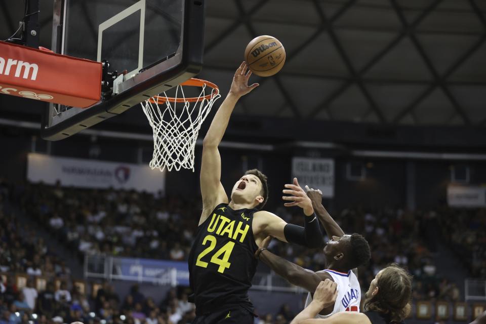 Utah Jazz’s Walker Kessler goes for a rebound over the Los Angeles Clippers during a preseason game Sunday, Oct. 8, 2023, in Honolulu. | Marco Garcia, Associated Press