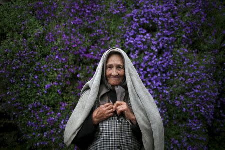 Zulmira Jesus poses for a portrait at a street in Povoa de Agracoes, near Chaves, Portugal April 19, 2016. REUTERS/Rafael Marchante